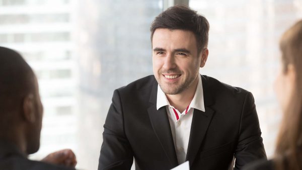 man-focusing-conversation-with-interviewers